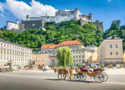 View of the culture city Salzburg with a castle and horse-drawn carriage
